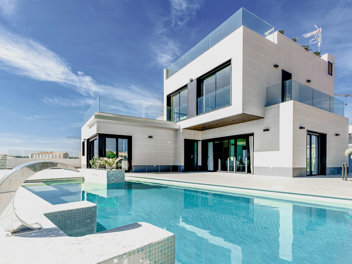 Contemporary home exterior with landscaping and large glass openings